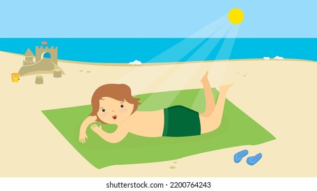 niño tomando sol en una alfombra verde