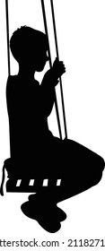 ein Junge, der sich mit der Silhouette umschwingt