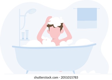 Un niño bañándose en una bañera.