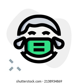 Boy with tears of joy facial expression wearing the mask to avoid diseases