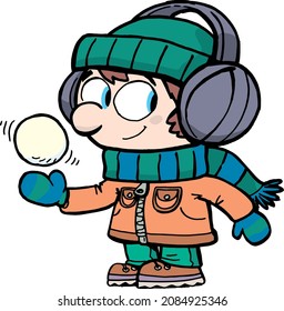 boy throwing a snowball in his hand and playing in the snow