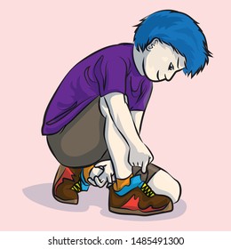 The boy tied the shoe preparing to play sports.