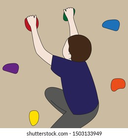 Boy trains at the climbing wall