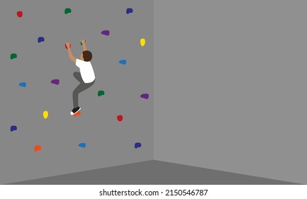 Boy trains at the climbing wall