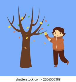 Chico y árbol con hojas caídas