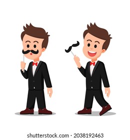 a boy in a tuxedo disguised with a fake mustache