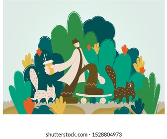 Boy and two cats are walking in the park