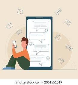 Boy is typing sms online sitting on the floor. Young man chatting  on smartphone. Mobile phone screen with text bubbles or clouds and smiles. Cell phone communication illustration.