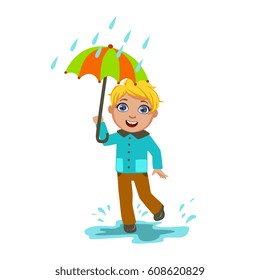Boy Under Raindrops With Umbrella , Kid In Autumn Clothes In Fall Season Enjoyingn Rain And Rainy Weather, Splashes And Puddles