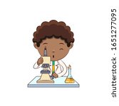 Boy using microscope, scientist cute child
