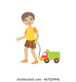 Boy Walking Dragging Toy Truck On A String