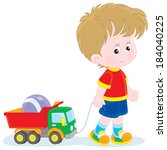Boy walking with toys