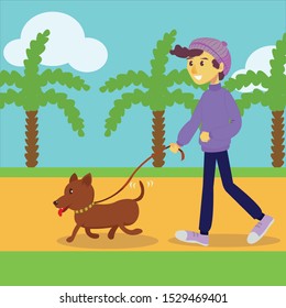 A boy walks with his dog in the garden 