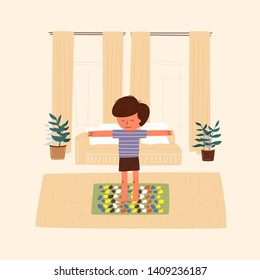 The boy walks on a massage mat in the apartment. Morning exercise and treatment of flatfoot. Vector flat illustration.