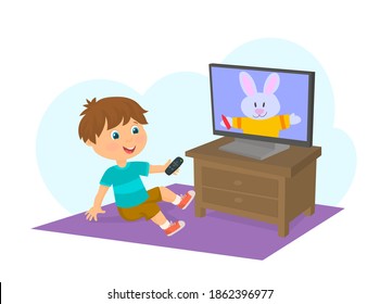 Boy watching cartoons on television with remote control in hand