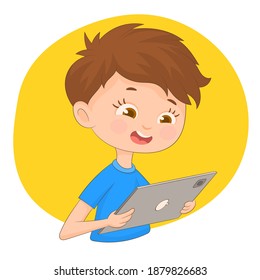 Boy watching his tablet with yellow background