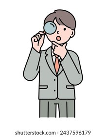 The boy is watching with a magnifying glass.