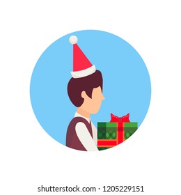 boy wearing hat holding gift box happy new year merry christmas concept male face avatar profile cartoon character portrait isolated vector illustration