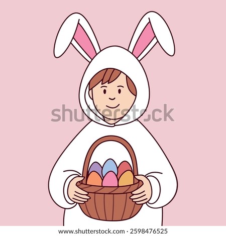 A boy in a white bunny costume holds a basket filled with colorful Easter eggs. He is smiling happily.
