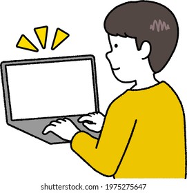 Boy in yellow clothes using a computer