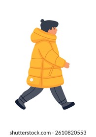  boy in yellow jacket walking side view