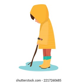 A boy in a yellow raincoat and rubber boots. A puddle after the rain. The boy is playing. Autumn. Cartoon style. Isolated vector image