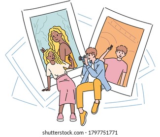 Boyfriend is taking a picture of his girlfriend. hand drawn style vector design illustrations. 