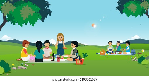 Boys and girls are eating picnic in the garden.