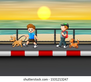 Boys with his dogs walking near the coast