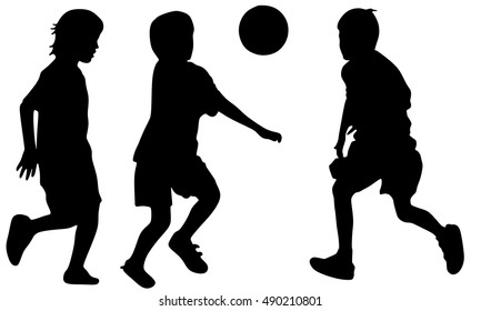 boys kicking football on the sports field