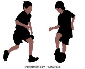 boys kicking football on the sports field