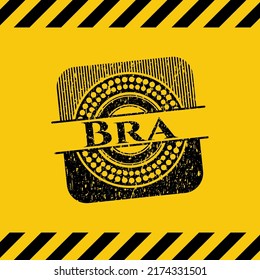 Bra grunge black emblem with yellow background, warning sign. Vector Illustration. Detailed. 