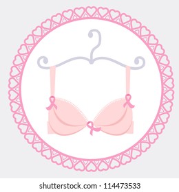 Bra with pink ribbon in a round frame to help promote Breast cancer awareness.