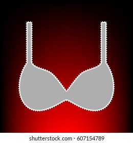 Bra simple sign. Postage stam or old photo style on red-black gradient background.