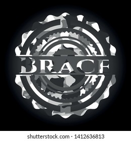 Brace on grey camouflaged texture
