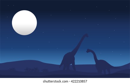 brachiosaurus and moon silhouette at the night