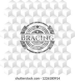 Bracing grey emblem with geometric cube white background