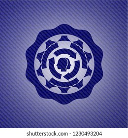 brain storm icon inside badge with denim texture