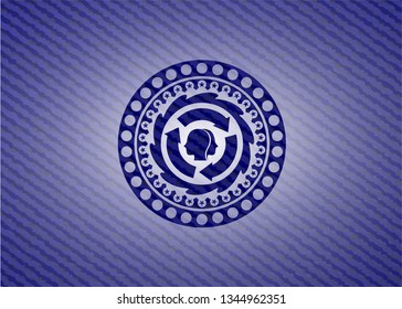 brain storm icon inside badge with denim texture