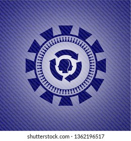 brain storm icon inside badge with denim texture
