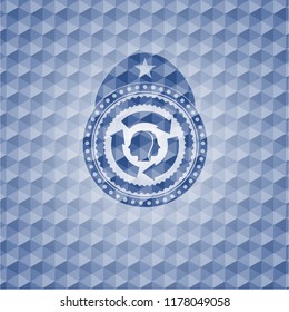 brain storm icon inside blue emblem with geometric pattern.