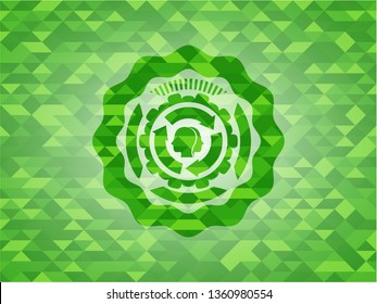 brain storm icon inside green mosaic emblem