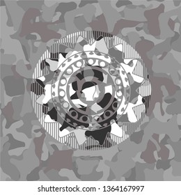 brain storm icon inside grey camo emblem