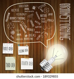 Brainstorming with bulb and stickers on the wooden table.
