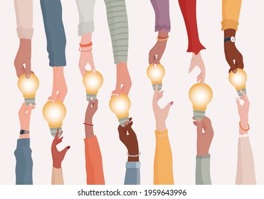 Brainstorming concept.Metaphor of diverse people proposing or sharing innovative ideas solutions and agreements.Collaborating colleagues or co-workers.Hands holding a light bulb.Teamwork