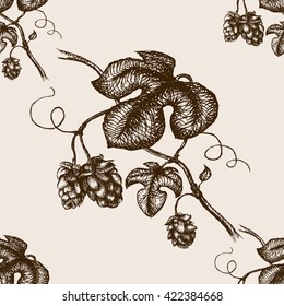 Branch of hops  sketch style seamless pattern vector illustration. Old engraving imitation.