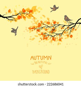 Branches with autumn leaves and birds on yellow background. Copy space