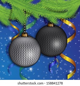 branches of a Christmas tree and gray spheres