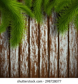 Branches of a Christmas tree on a wooden surface. Vector Image Stock.