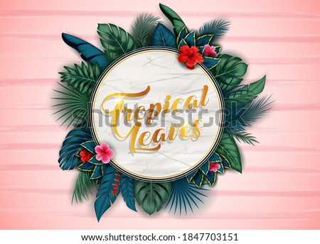 Branches and leaves of tropical plants. Round floral frame